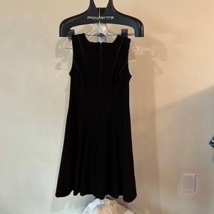 Calvin Klein with leather detail front and back. Black below the knee.